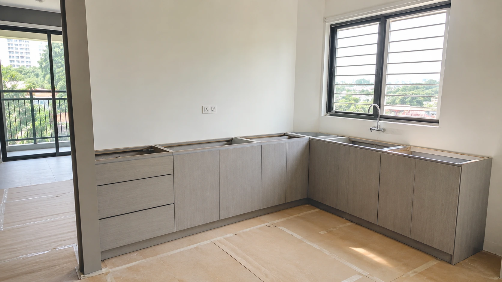 Newly installed kitchen cabinets in a Malaysian home ready for countertop templating, with no countertop surface yet fitted Newly installed kitchen cabinets in a Malaysian home ready for countertop templating, with no countertop surface yet fitted
