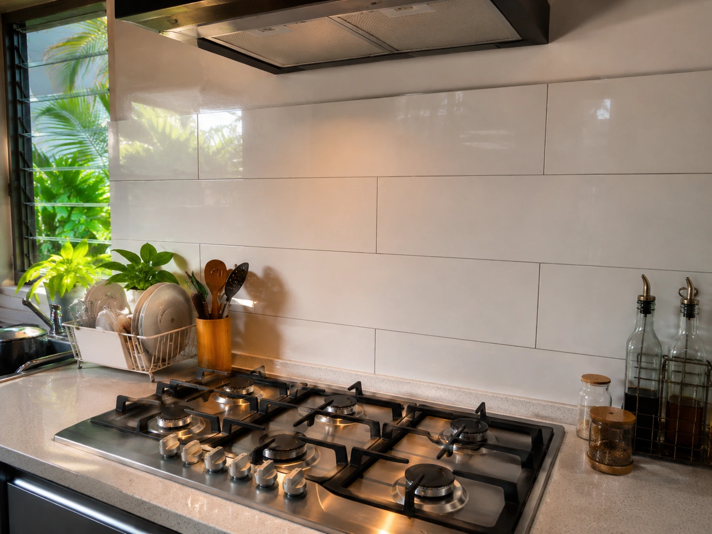 Traditional porcelain tile kitchen backsplash in a Malaysian home with visible grout lines behind a gas hob Traditional porcelain tile kitchen backsplash in a Malaysian home with visible grout lines behind a gas hob