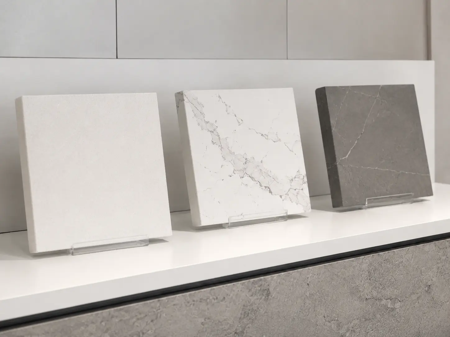 Premium stone countertop brands — Caesarstone, Silestone, and Dekton displayed in a showroom