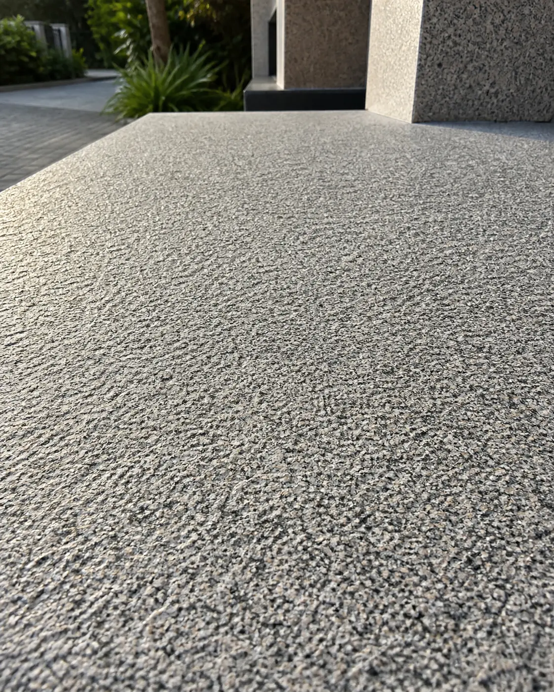 Flamed-finish granite flooring on an outdoor porch area of a Malaysian home showing slip-resistant texture Flamed-finish granite flooring on an outdoor porch area of a Malaysian home showing slip-resistant texture