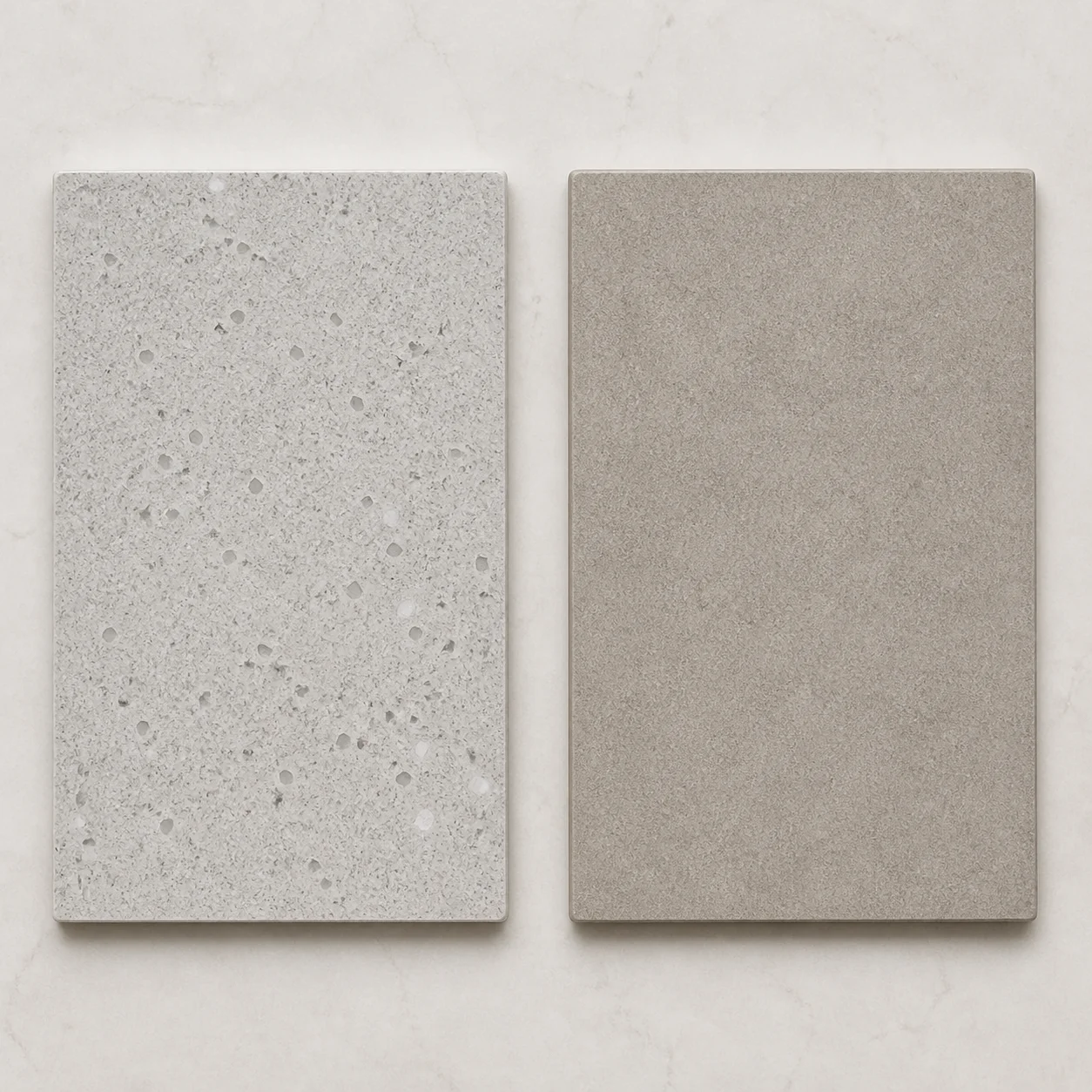 Quartz and sintered stone sample pieces placed side by side for a Malaysian kitchen renovation comparison